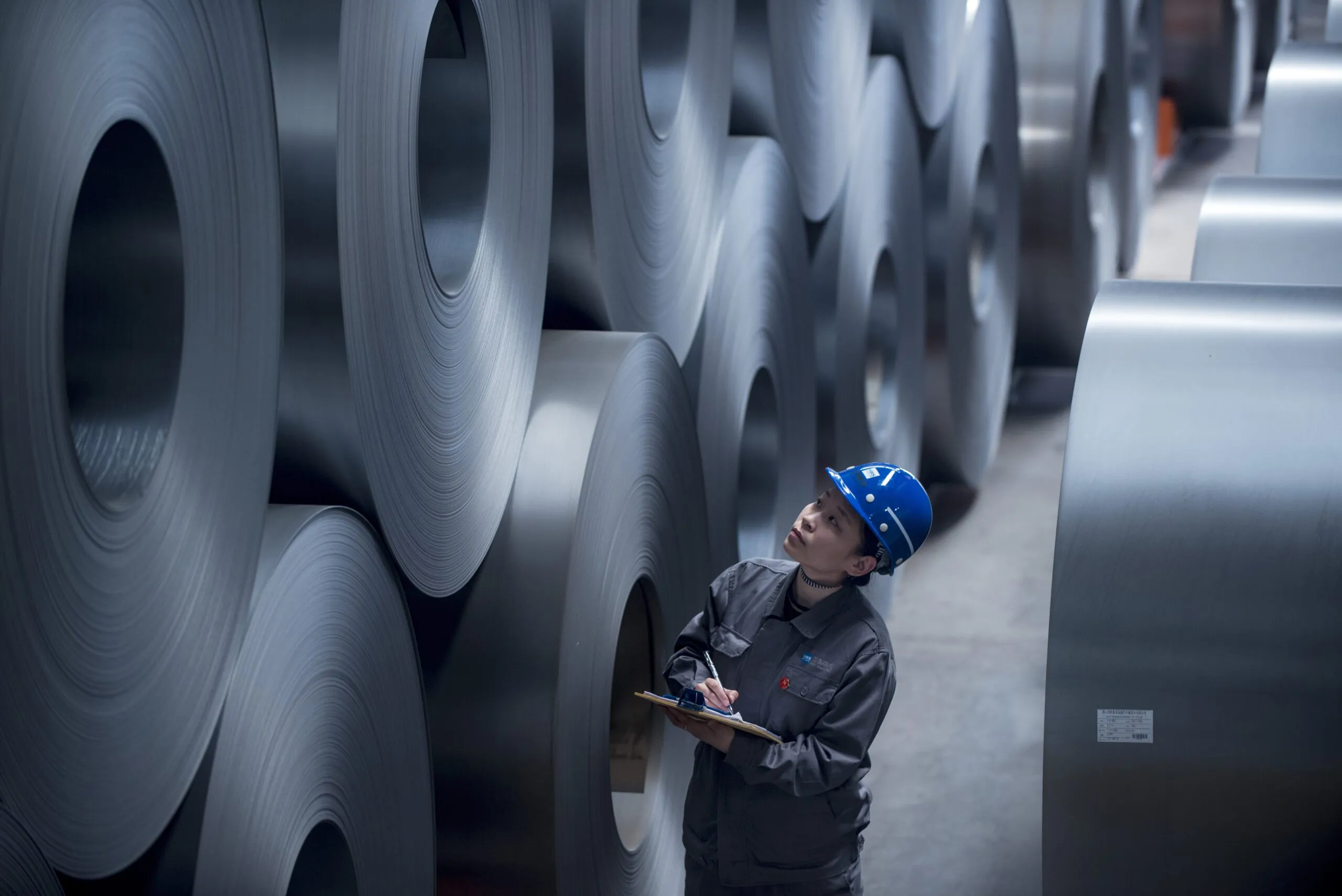 Engineer inspecting metal